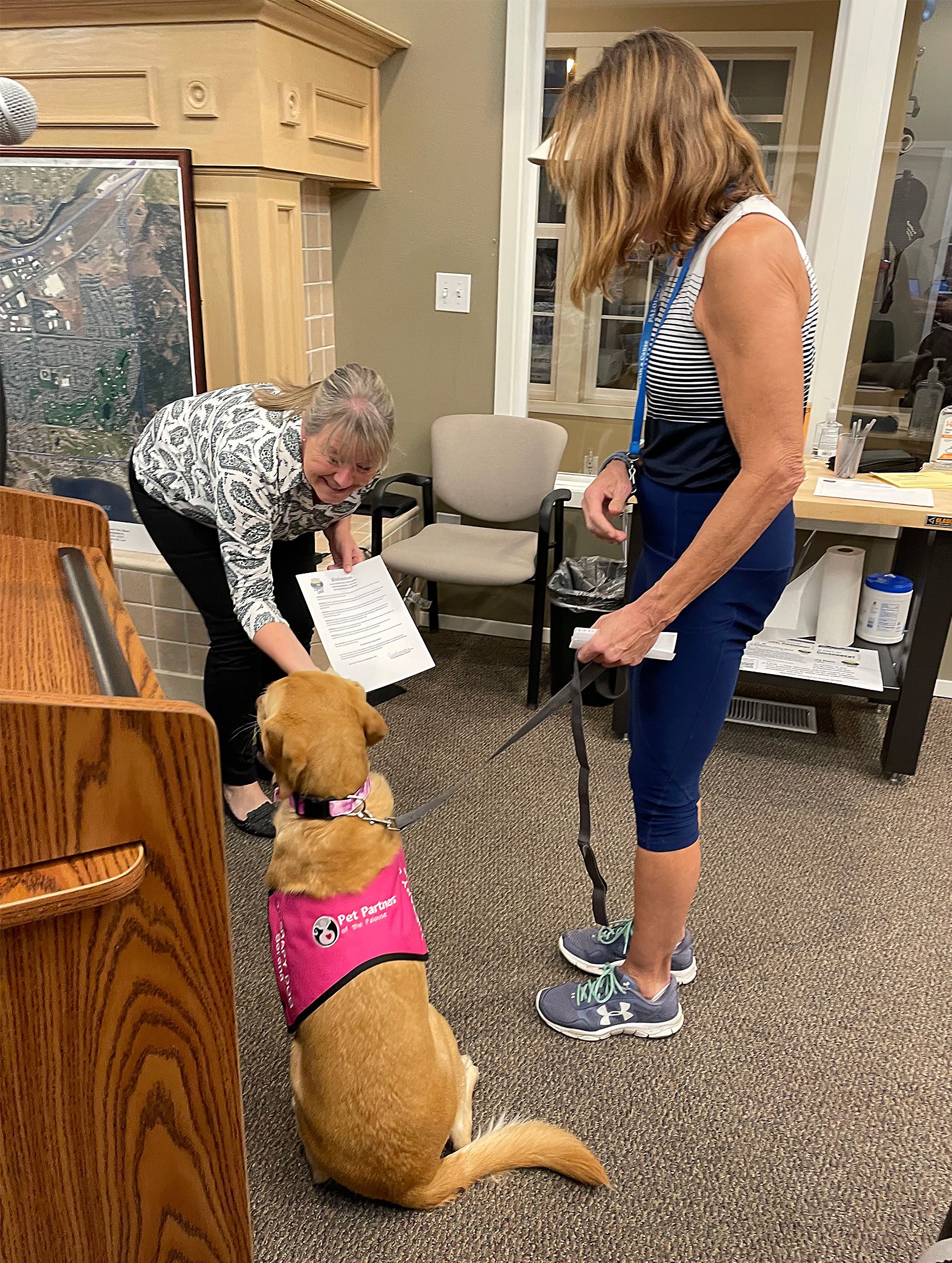 Mayor Cris Kaminskas petting service dog