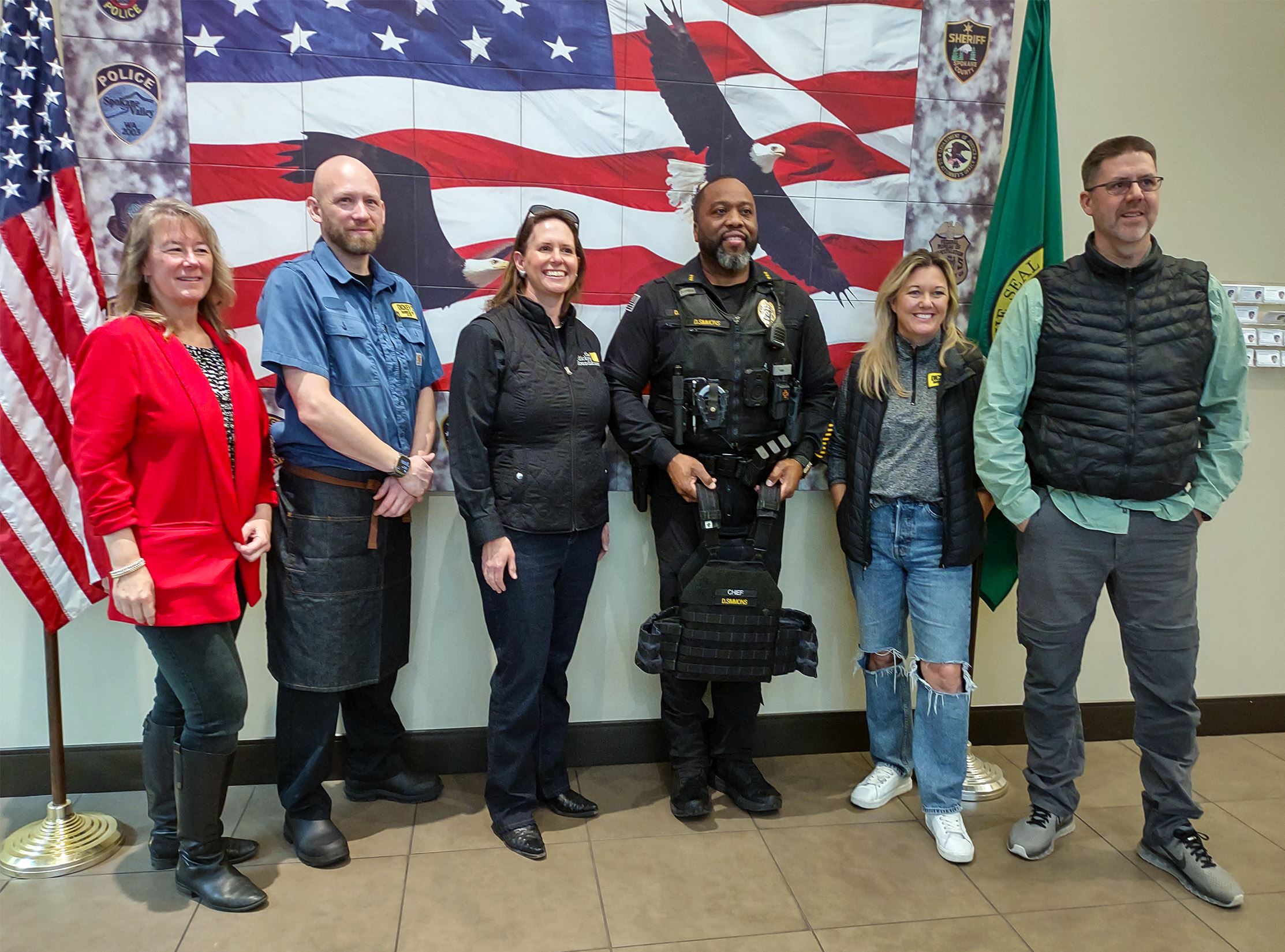 Mayor, representatives of Dickey's restaurants, and Liberty Lake Police